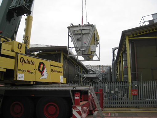 Crane lifting the new cooling units.